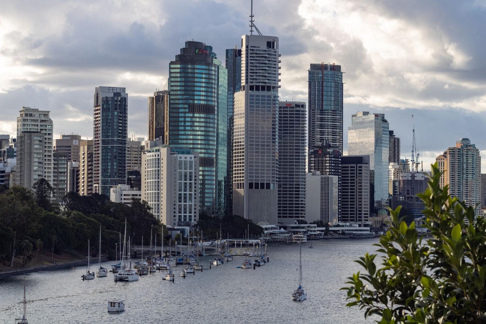 White and Brown High Rise Buildings near Body of Water